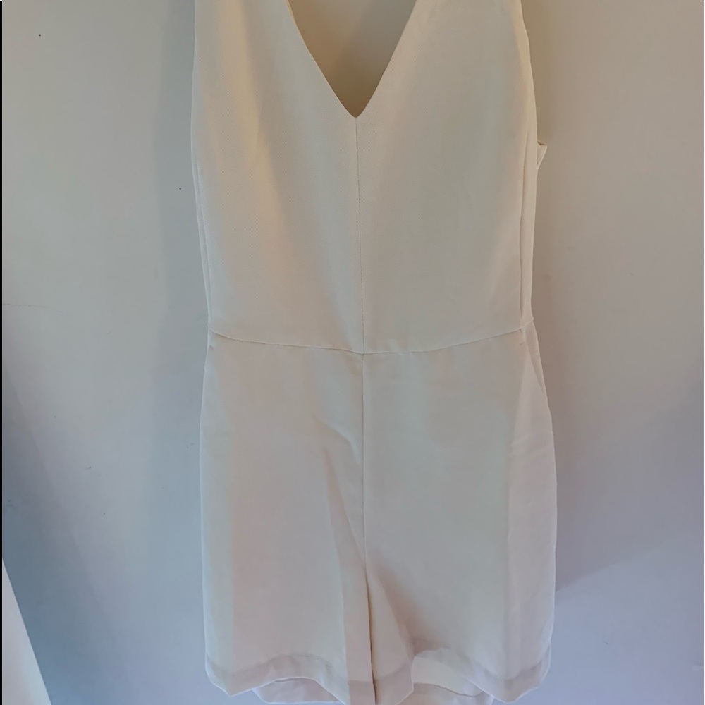 Woman sand color romper Size M never worn